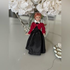 Porcelain dolls collectible from different eras based on popular stories.
